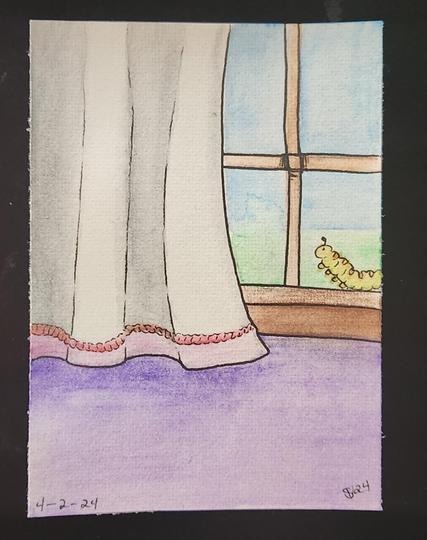 Little caterpillar sitting on a windowsill 