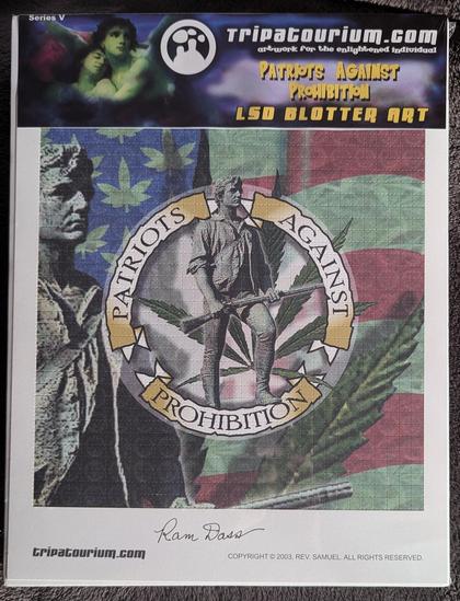 The image is a shrink-wrapped LSD Blotter Art print entitled "Patriots Against Prohibition" by Rev Samuel and signed by Baba Ram Dass. In the center of the print, there is a circular emblem with the words "Patriots Against Prohibition" written in gold lettering. The emblem is surrounded by a green marijuana leaf and an American flag. On the left side of the emblem, there are two figures of a minuteman holding a rifle in his hands ready to defend your freedom standing in front of the flag background. In the bottom center of the print in the border is Ram Dass' signature.