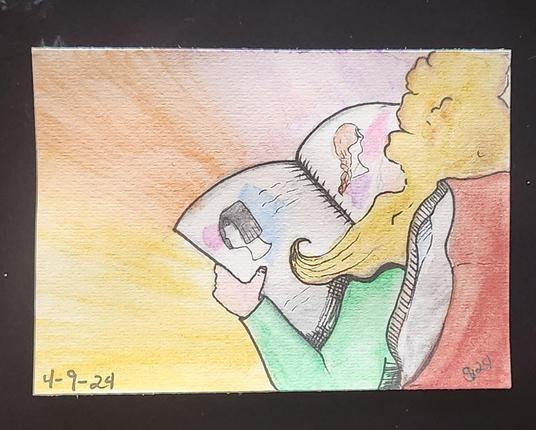 Reading about new hair styles while relaxing in bed