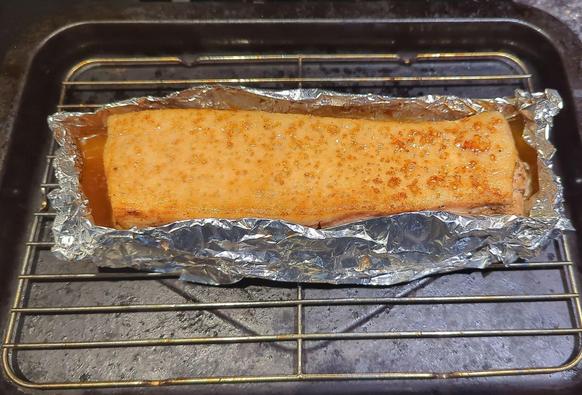 Pork belly after being cooking in the oven, and finished under the broiler 