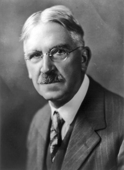 Today I am posting a picture of John Dewey. He was an important American philosopher and educational reformer. He saw reflective thinking and learning through active inquiry as fundaments of democracy. He was a pioneer of undergraduate research (UR) and CRITICAL THINKING. But we don't really know what effect this has on society. It is obvious that the effect is triggered by epistemological beliefs: i.e. those who do not believe in science (but only as a qualification for practicing a profession) will not necessarily make critical thinking and learning through active inquiry the basis of their political worldview.

Undergraduate Research Handbook (https://doi.org/10.1017/9781108869508): Critical thinking is mentioned in more than one in three chapters, even in the chapter on UR in Russia. Chapter on Assessment of UR: According to EvaluateUR, critical thinking is assessed together with problem solving, namely via (i) Challenges established thinking when appropriate; (ii) Looks for the root causes of problems and develops or recognizes the most appropriate corrective actions; (iii) Recognizes flaws, assumptions and missing elements in arguments.

Picture attribution: Underwood & Underwood, Public domain, via Wikimedia Commons

Your input is very welcome. 
Best, Harald 
