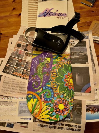 Snowboard with jungle drawing