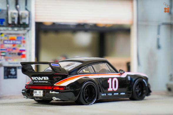 A right side of Porsche RWB 964 Black, No.10 Thailand Special Edition by Tarmac Works in 1:64 scale on AREA 164
