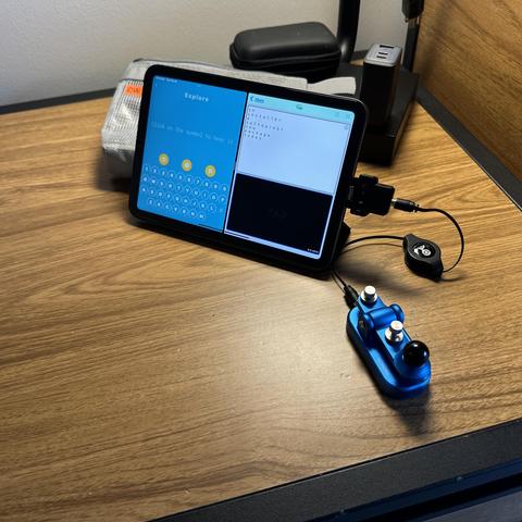 An N6ARA ble midi adapter connected to an iPad mini with Morse-It and Morse Mania running. A Putikeeg CW key is attached using a retractable TRS cable. 