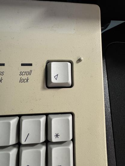 The power button of my Apple Extended Keyboard - a once unusable key on modern Macs is now functional once again. 
