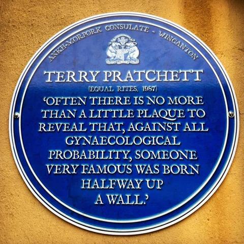 "Ankh-Morkpork Consulat - Winganton. Terry Pratchett, Equal Rites (1987) 'Often there is no more than a little plaque to reveal that, against all gynaecological probability, someone very famous was born halfway up a wall.'"