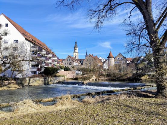 View on the city of Crailsheim, over the river Jagst with a tree in the foreground