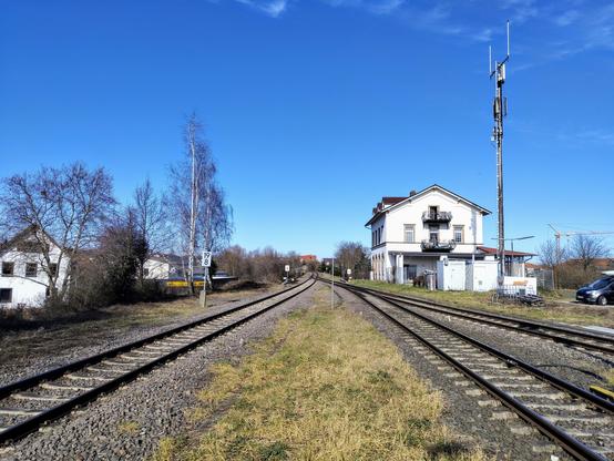The former station building of Freinsheim with rails in the foreground