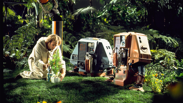 Still from Silent running showing Freeman Lowell in the Forest Dome of the Valley Forge with two of the three service drones known as Huey, Dewey and Louie