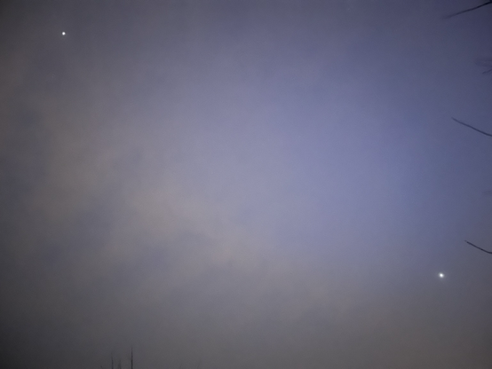 Cloudy night sky with only Venus & (probably) Jupiter visible