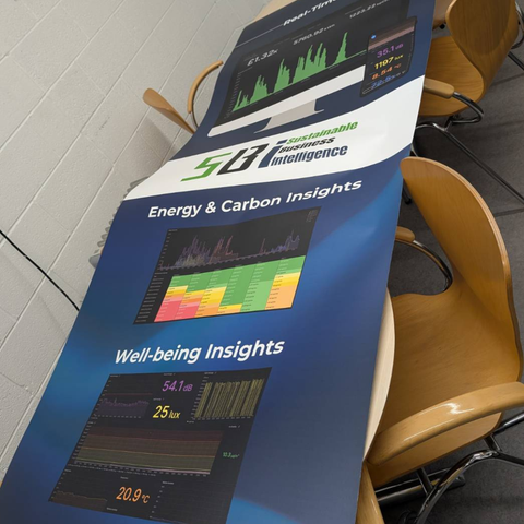 exhibition graphic panel lay across the canteen tables