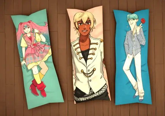 A third screenshot borrowed from the Patreon post, showing three long body pillows. The first one features Miki, the virtual idol that is a recurring theme in the game, with her long pink hair ; the second one is an androginous anime character with fairly dark skin and bleach blond hair in a white vest ; the third is an male anime character with green hair and a long pointy chin, holding a red rose.