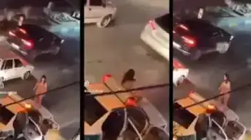 Das Bild zeigt eine Frau in Mashad/#Iran, die sich aus Protest gegen die Islamische Republik auszieht und nackt auf das Dach eines Polizeiautos springt. Dieser Mut ist unbeschreiblich.