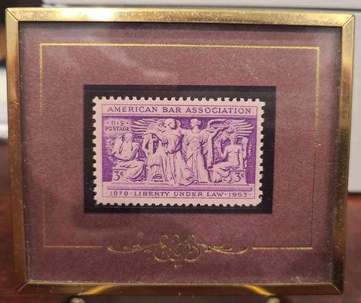 Framed 1953 American Bar Association postage stamp depicting allegorical figures, "Liberty Under Law".