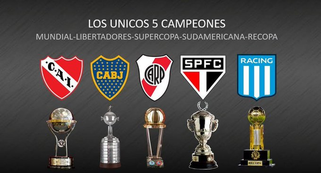 A imagem mostra os escudos de cinco times de futebol: Independiente, Boca Juniors, River Plate, São Paulo e Racing. Abaixo de cada escudo, há uma taça de campeonato diferente. O texto acima dos escudos diz "Los Unicos 5 Campeones Mundial-Libertadores-Supercopa-Sudamericana-Recopa", indicando que esses são os únicos cinco times que ganharam todas essas competições. O fundo da imagem é cinza escuro.