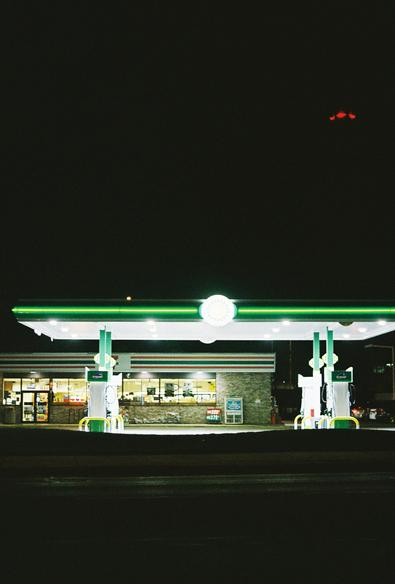 A gas station at night.