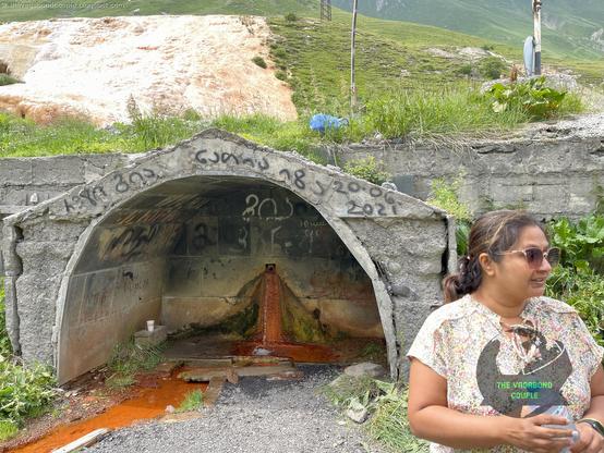 The Travertine Mineral Springs along Georgian Military Road (E-117 towards Verkhnii-Lars Russia border): https://thevagabondcouple.blogspot.com/2025/02/georgia-tbilisi-gudauri-kazbegi-russian-border-july-2021.html

Red & white terraced travertine mineral springs are formed through a fascinating geological process involving water, minerals & time when groundwater, heated by geothermal activity deep within the Earth, rises to the surface carrying dissolved calcium carbonate (CaCO₃) & other minerals. As the water emerges & cools, it releases carbon dioxide (CO₂) causing the calcium carbonate to solidify into travertine, a type of limestone. This process creates iconic white terraces often seen in these formations. The red or orange hues in some travertine terraces like this one, & rarely visited one a mile from white Pamukkale, Turkey terraces, come from the presence of iron oxide & other minerals also dissolved in the water. These minerals oxidize upon contact with air, giving the terraces their warm, reddish tones. Over time, the continuous flow of mineral-rich water builds up layers of travertine, forming the stepped, terraced structures that are both visually stunning and scientifically intriguing. The geological activity that drives these springs is linked to tectonic plate movements which create fractures in the Earth’s crust, allowing heated groundwater to rise.

#VagabondCouple #sakartvelo #Georgia #travertine #travel #travelblogger #traveltheworld #travelphotography