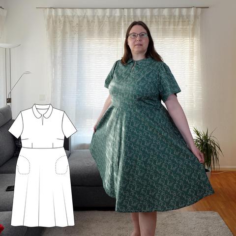 Photo of a woman in a green shirtwaist dress covered in drawings of little elephants. The dress has a Peter Pan collar, short sleeves and a half circle skirt. On the left is a line drawing of the pattern.