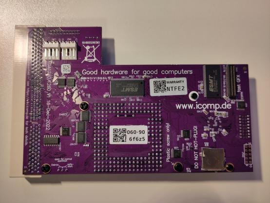 ACA1260 top side, purple PCB, white Amiga 1200 edge connector, showing the solder side of the 68060 socket, that facing downwards. Some RAM and other chips, an SD card socket, and the connector for the future "fast GFX" expansion is also visible.
