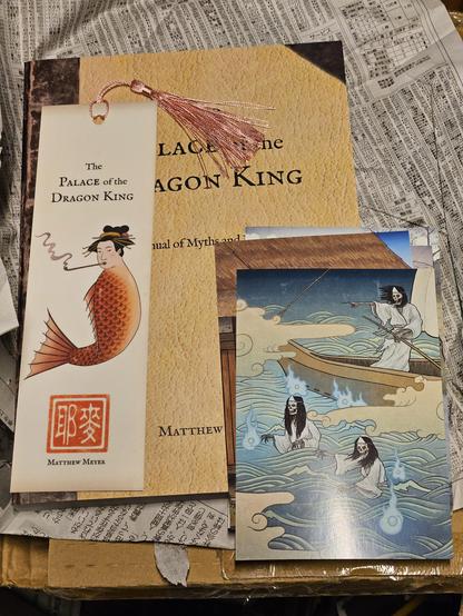 Book of Japanese folklore; bookmark feat. mermaid smoking opium pipe; postcard feat. ghost pirates.
