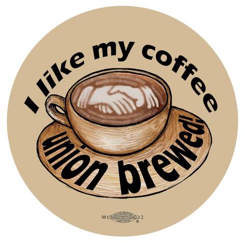 Text:
I LIKE MY COFFEE 
 U N I O N Brewed 

Image: a cup (and saucer) of coffee 
There are two hands shaking 🤝 in the froth on top 
