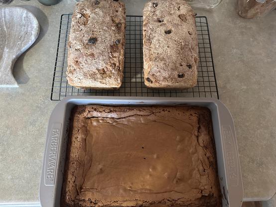 Brownies and two loaves of multigrain bread with raisins and cashews, fresh from the oven.