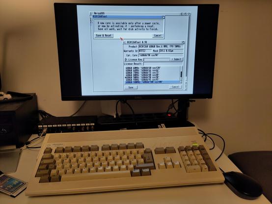 An Amiga 1200 with an ACA1260 accelerator, running the ACATune tool and a warning dialog about a reboot, while bumping up the operating frequency to 100Mhz.