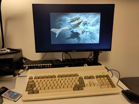 An Amiga 1200 with an ACA1260 accelerator, running a scene from the demo Starstruck by TBL, one of the most demanding demos for a '060 accelerator.