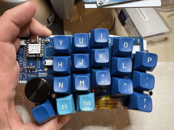 Holding right half of Klein split keyboard in my hand.