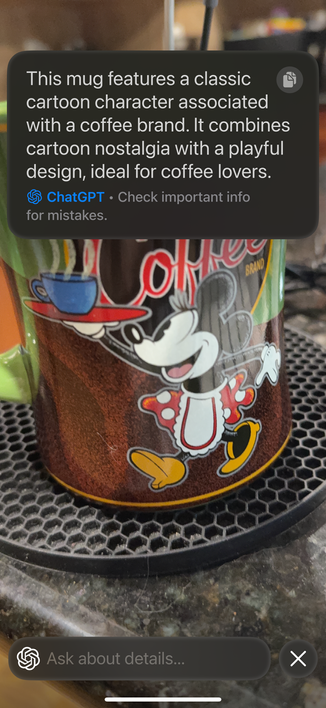 A coffee mug, labeled with the text from ChapGPT:
    "This mug features a classic cartoon character associated with a coffee brand. It combines cartoon nostalgia with a playful design, ideal for coffee lovers.
© ChatGPT - Check important info for mistakes.