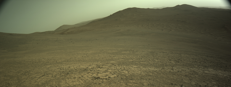 An ochre toned image capturing a Martian landscape of hills and dunes.
