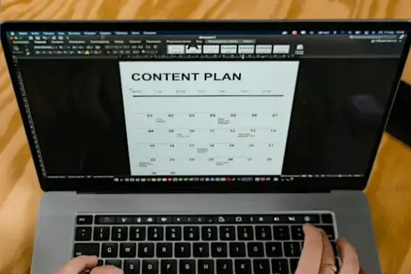 Notebook with Content Plan displayed on monitor
