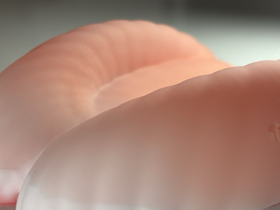 Detail image of a silicone sex toy designed for transfemmes and non binary folks. Image is cropped to hide full view to create suspense leading up to the official release.