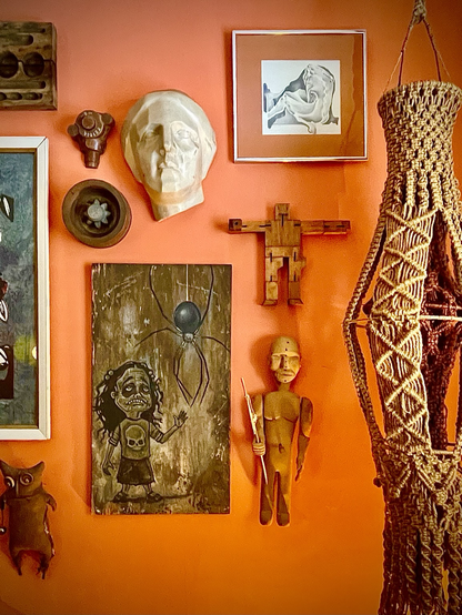 Odd art and a macrame plant hanging