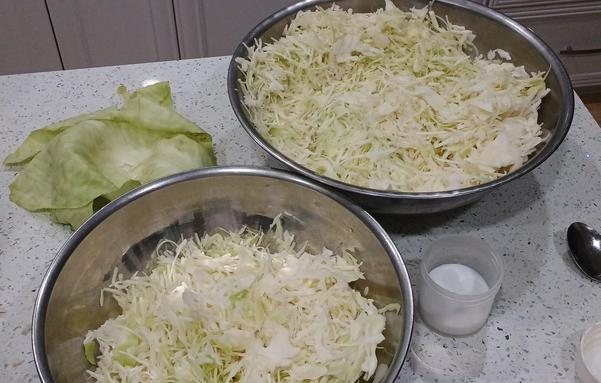 Two big bowls of shredded cabbage.