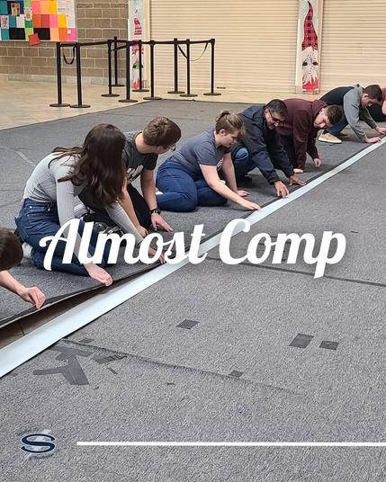 A photo of students working on a practice field