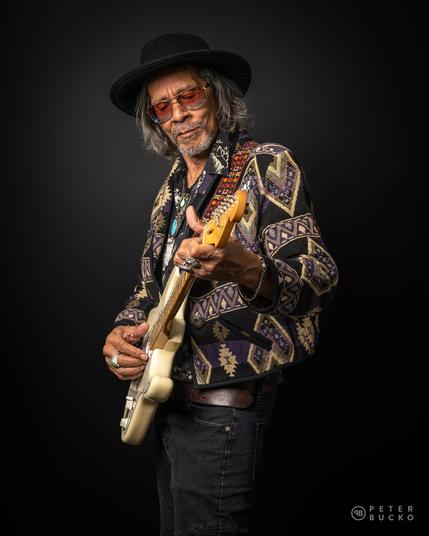 Leon Morris Hendrix playing on electric guitar.