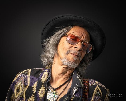 Leon Morris Hendrix posing on black background at studio.