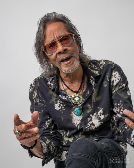 Leon Morris Hendrix posing on white background at studio.