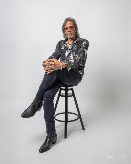 Leon Morris Hendrix posing on white background at studio.