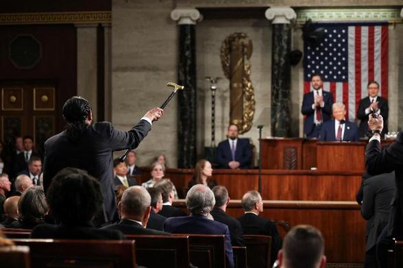Rep. Al Green makes his protest during Donald Trump's speech by shouting, "You have no mandate to cut Medicaid!" (Win McNamee/Pool via Reuters)