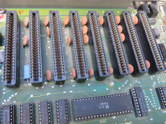 A photograph of the 8 peripheral card slots in an Apple II plus.