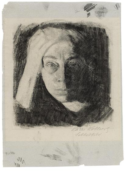 Käthe Kollwitz Self-portrait en face, c 1910

Charcoal on grey-blue Ingres paper. 

This self-portrait can be dated around 1910 and shows the artist in her favourite pose – her arm resting on the table and her head supported by the hand on her forehead while looking into the mirror and concentrating on her drawing.

In her drawings and prints, the artist portrayed herself again and again in this pensive, often explorative and always self-reflective manner. Even photographers such as Hugo Erfurt often captured Käthe Kollwitz in this pose.

The softness of the charcoal, which she tried out on the margin of the sheet, and the strong chiaroscuro effects that are the result of a light source from the bottom left, result in a sensuous expression that is rare in the artist’s work.

This sheet from the artist’s estate also reveals the photosensitivity of some of the papers used by Kollwitz.