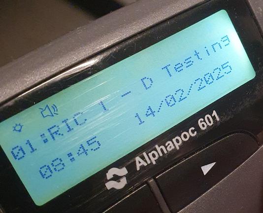 Display of an Alphapoc 601 pager showing the received message "Testing", which was sent from the new transmitter.