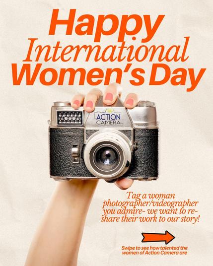 Promotional graphic celebrating International Women’s Day. The image features a hand with neatly painted nails holding a vintage film camera with the Action Camera logo placed on it. The bold text at the top reads, 'Happy International Women’s Day' in vibrant orange. Below, a message encourages viewers to tag a woman photographer or videographer they admire so their work can be reshared. A right-facing orange arrow points to a note that invites viewers to swipe to see how talented the women of Action Camera are. The background is a soft beige tone, complementing the retro aesthetic of the camera.