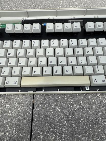 A torn apart AEK with the spacebar. Dusted and cleaned, with retrobrite applied to the spacebar.
