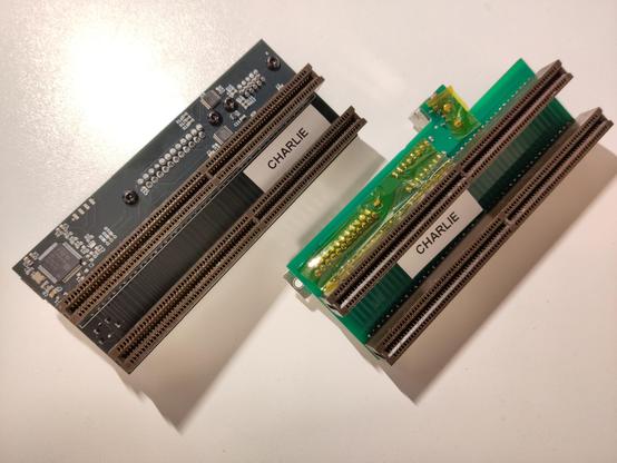 A sordan.ie "Imperator CD32" adapter and a Kipper2k CD32 adapter side by side, showing the side that faces inside the console.