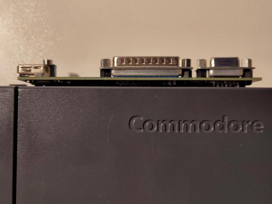 Upside down shot of the Imperator CD32 riser as it's fitted to the CD32, showing a thin gap between it and the CD32 itself.