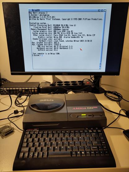 TerribleFire 360 expanded CD32 running with the Imperator CD32 adapter, showing the early startup console, and.output of WhichAmiga. The gray background of the console shows no noise or jailbars, looking good.