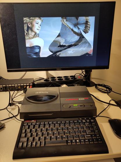 TerribleFire 360 expanded CD32 running with the Imperator CD32 adapter, running the 68060 demo Prototype 1 by Haujobb.